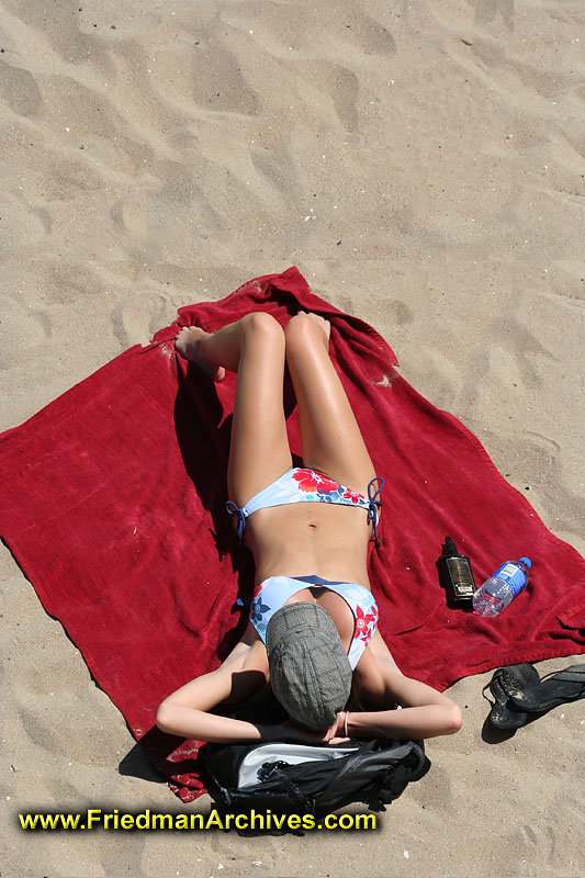 california beaches girls. Girl and Red Towel on Beach