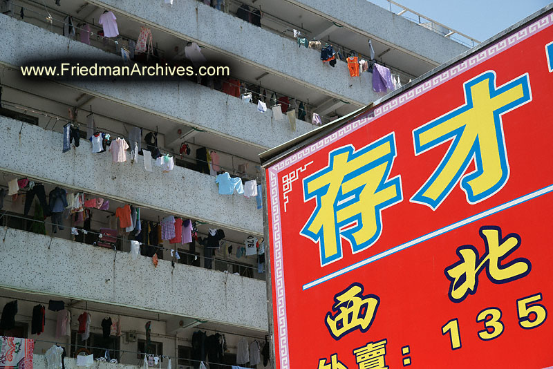 Chinese sign and laundry hanging apartments