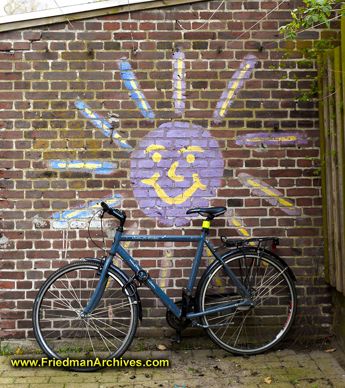 copenhagen,denmark,still life,bicycle,grafitti,painting,sun,brick,