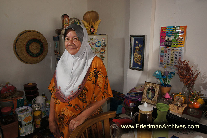muslum,woman,apartment,home,environmental portrait,malaysia,orange,wireless flash,poor,