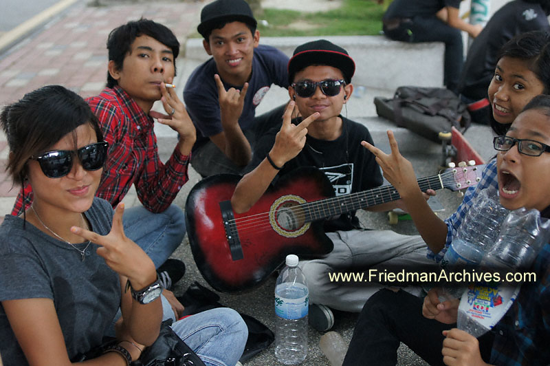 teenagers,malaysia,kuala lumpur,peace,smoking,guitar,hanging out,