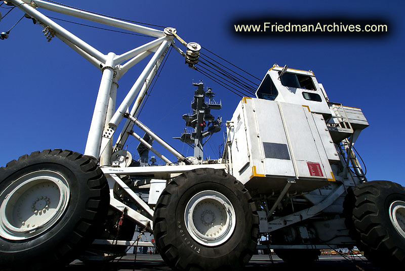 tow truck,crane,wheels,aircraft,aircraft carrier,helicopter,maintenance,navy,ship,military,war ship