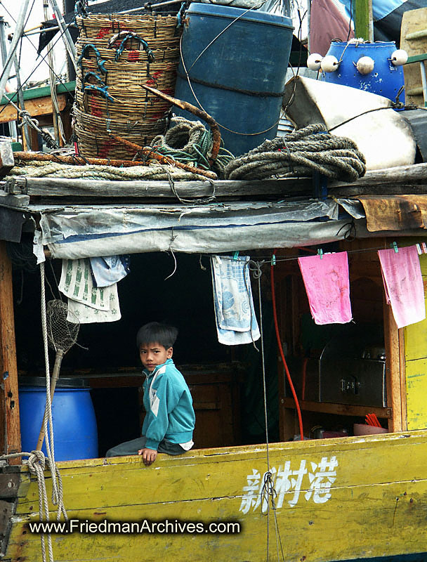 Boy in back of boat