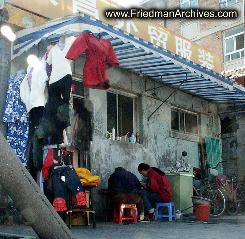 People eating under awning