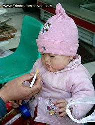 Baby and cigarette