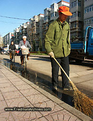 Man with Orange Hat and Broom