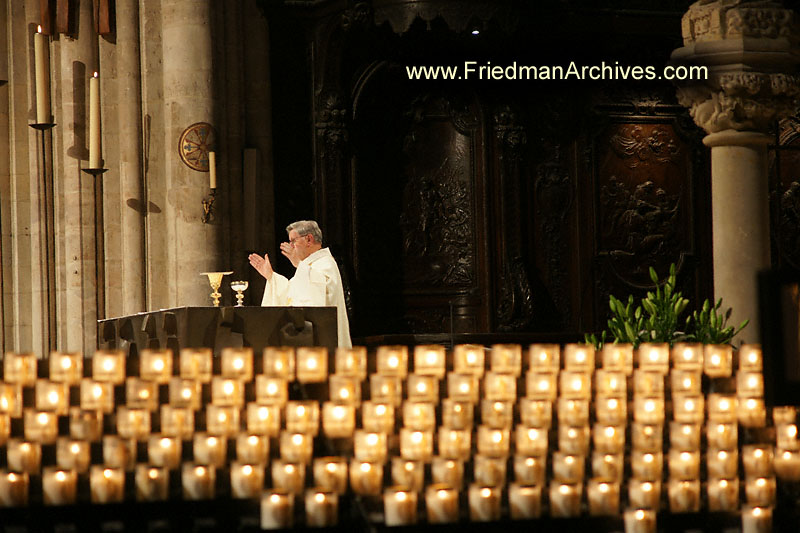 prayer,priest,water,wine,robe,hands,religion,mass,father,france,paris,europe,travel,holiday,vacation,tourist,stock