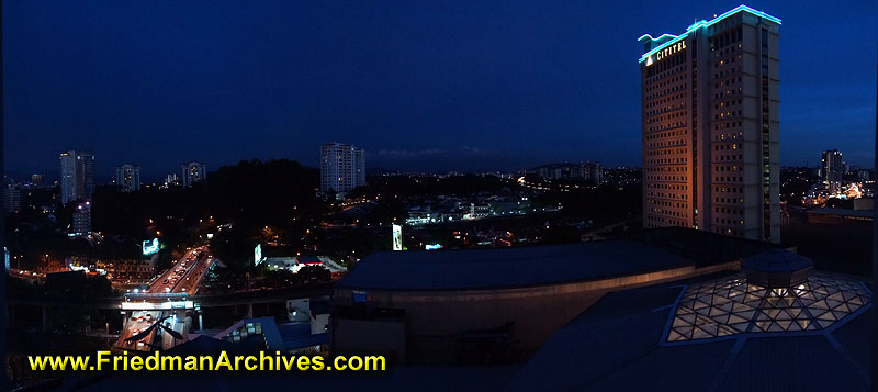 time exposure,building,skyscraper,modern,Malaysia,office,panorama,interchange,mountains,dusk,nighttime,