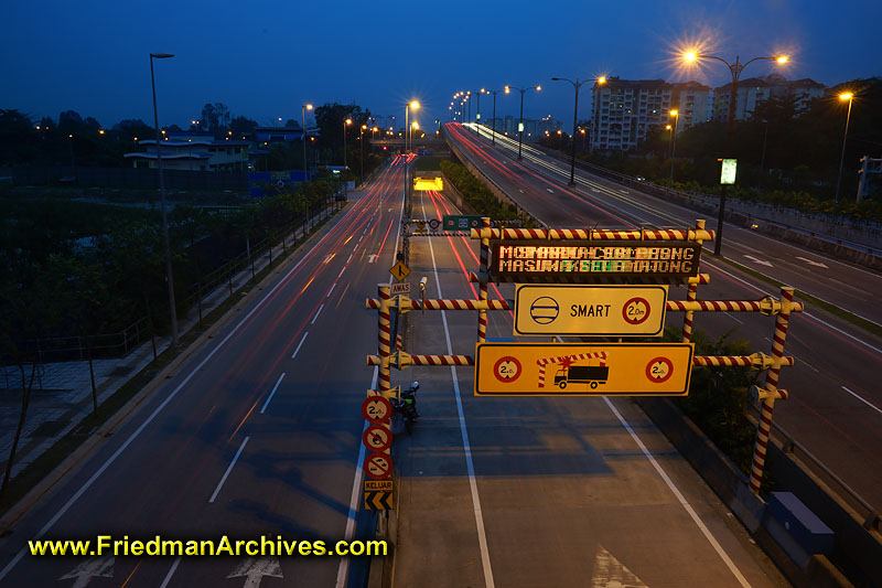 dusk,dawn,transportation,car,freeway,highway,road,signs,