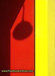 Lamp Shadow on Red and Yellow Wall DSC04660