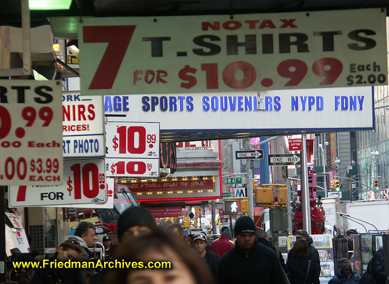 sidewalk,urban,city,pedestrian,crowded,signs,chaos,tourist,t-shirts,souveniors,economy