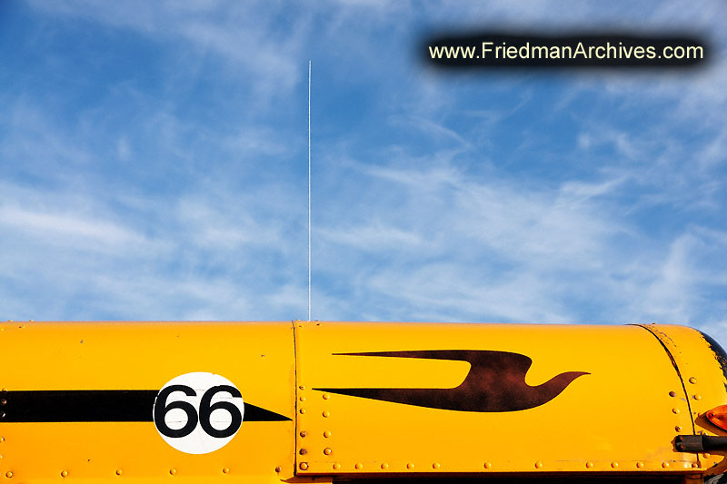 school bus,bird,logo,sky,clouds