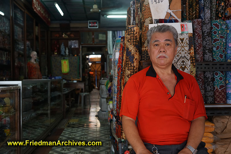 singapore,store,retail,businessman,entrepreneur,vendor,cloth,silk,clothing,textile,storefront,