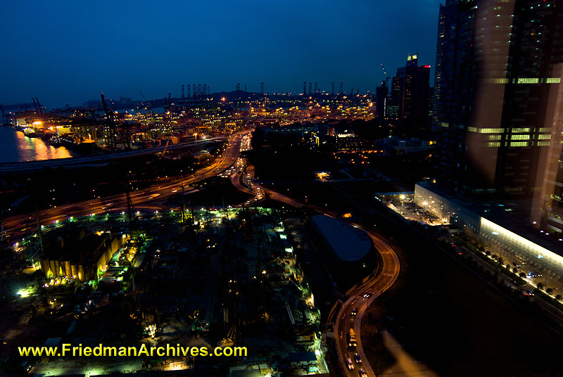 architecture,nighttime,blue,dusk,dawn,city,night,time exposure,sky,buildings,office,tower,skyscraper,transportation,headlights,highways,