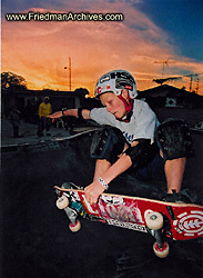 Skateboard kid at sunset