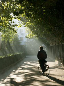 A cyclist at 6:00 AM.