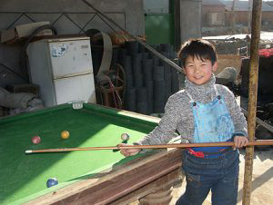 Boy playing pool