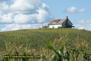 Farm House on a Hill with Red and White Roof