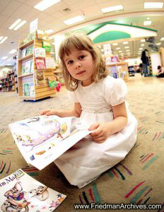 Girl Reading at Library