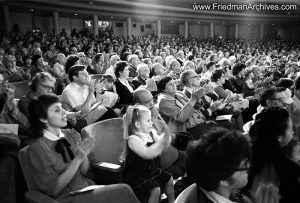 Girl clapping in audience