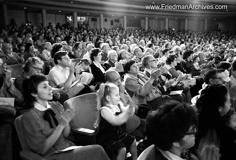 Girl clapping in audience