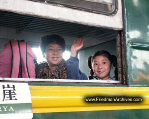 Girl waving from train