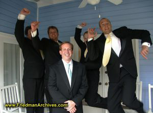 Groom and jumping groomsmen