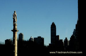 Statue and Silhouetted Skyline