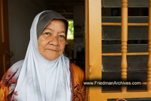 Old Muslum Woman by doorway