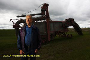 Portrait of Herman Siemens and Threshing Machine