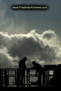 Silhouettes Clouds and Rail