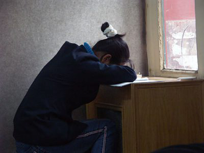 Sleeping_at_desk_near_window