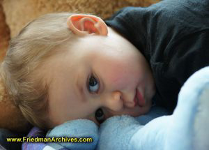 Toddler Lying on Blue Bear